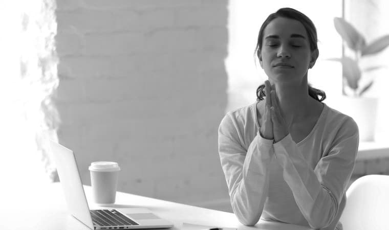 Woman using the Daily Examen other Ignatian prayers